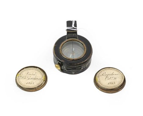 A 19th Century Bronzed Copper "Duke of Wellington" Small Box and Cover, of seal form, containing a concertina of circular pap