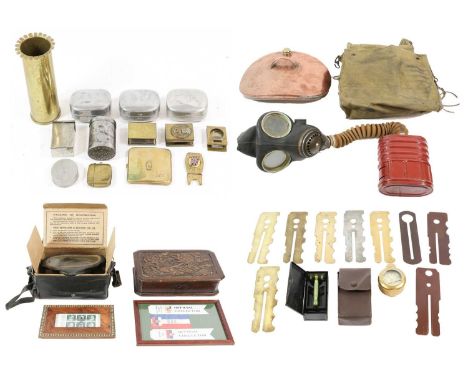 A Quantity of Militaria, including button plates, Trench Art vases, matchbox holders, cigarette lighters etc, brass folding m