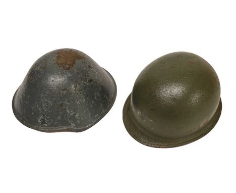 A US Second World War M1 Combat Helmet, with textured drab green paint to the exterior and smooth paint to the interior, swiv