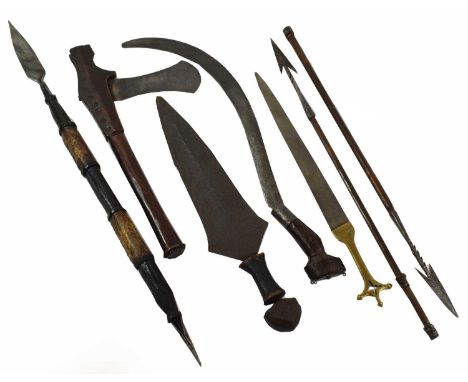 A 19th Century Congolese Sickle Sword, the curved iron blade incised with scrolls, with wood grip and elliptical iron twin pl