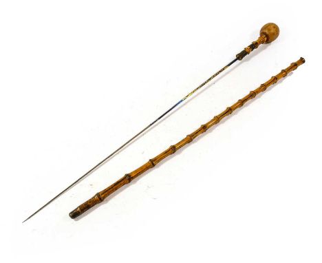 A 19th Century Bamboo Swordstick, the 66cm tapering diamond section blued steel blade decorated with gilt foliate scrolls, th