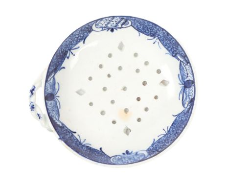 A RARE LOWESTOFT PORCELAIN EGG STRAINER. c.1775, the circular form painted with a version of the Fitzhugh border, the well re