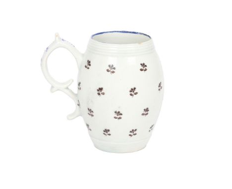 A RARE LOWESTOFT PORCELAIN MUG, CIRCA 1795. of barrel form with ribbed moulded lip and foot, the body decorated with floral s