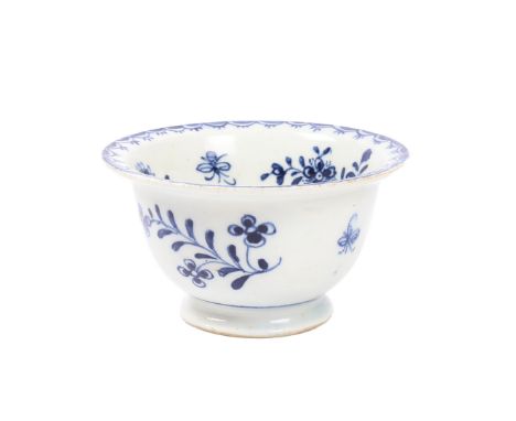 A RARE LOWESTOFT PORCELAIN BOWL, CIRCA 1770. the bowl with flared rim, decorated in the flowers and moth pattern, 8.5cm diame