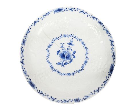 A LOWESTOFT PORCELAIN DISH. with moulded foliate decoration and underglaze blue floral sprays, 18cm diameter, 3cm high  J. Ho