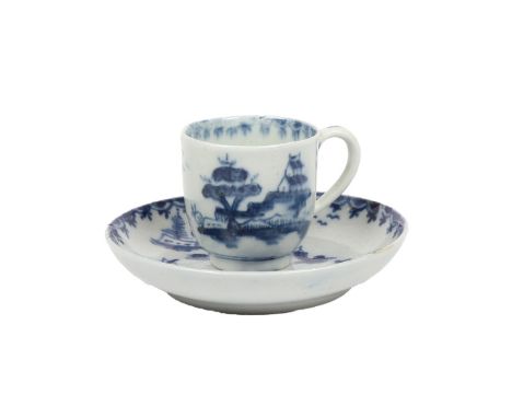 A LOWESTOFT PORCELAIN MINIATURE OR TOY CUP AND SAUCER. decorated with pagoda and island scenes with boats, within a berry bor