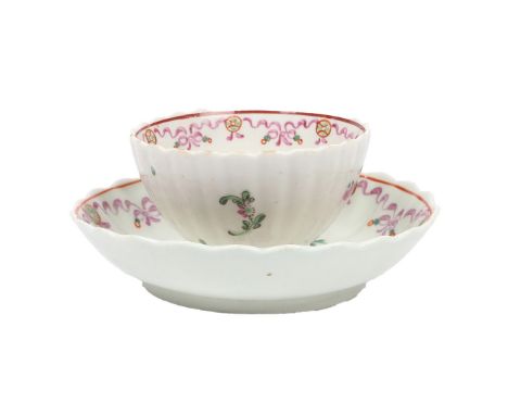 A LOWESTOFT PORCELAIN TEA BOWL AND SAUCER, CIRCA 1785. of ribbed form, decorated in the Curtis pattern, the tea bowl 7.5cm di