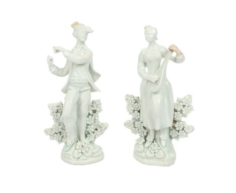 A RARE PAIR OF LOWESTOFT PORCELAIN FIGURES MODELLED AS MUSICIANS. circa 1780, in the white, modelled as a man playing a trian