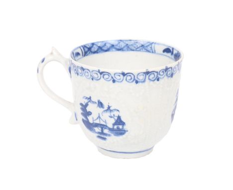 A LOWESTOFT PORCELAIN COFFEE CUP. circa 1761, the Hughes type moulded body with three circular vignettes depicting chinoiseri