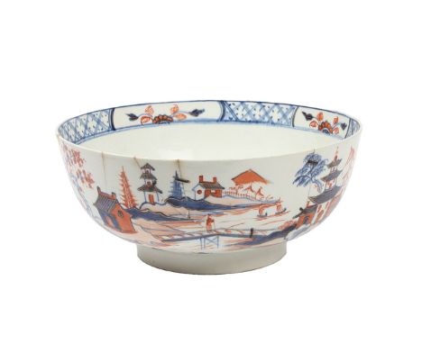 A LARGE LOWESTOFT PORCELAIN PUNCH BOWL, CIRCA 1785. decorated in the dolls house pattern, heightened in gilt, 23.5cm diameter