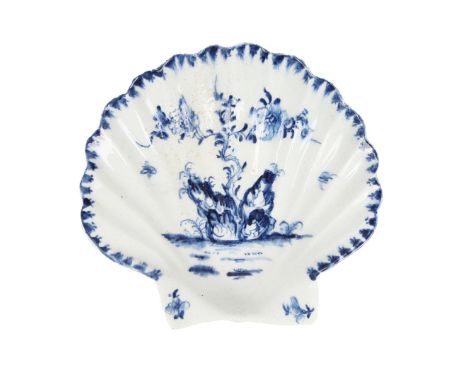 A LOWESTOFT PORCELAIN SHELL FORM DISH, CIRCA 1765. modelled as a scallop shell, painted in blue with a flowering tree issuing