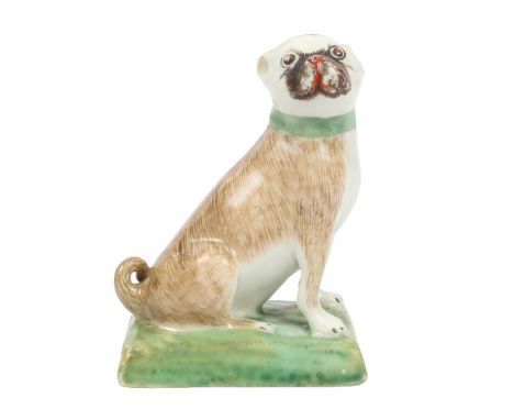 A LOWESTOFT PORCELAIN PUG DOG. circa 1775, modelled in a seated position with head turned to the right, with tan fur decorati