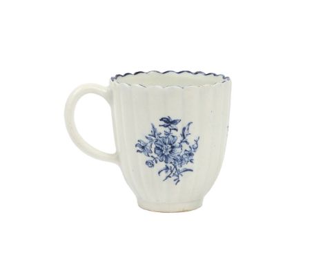 A LOWESTOFT PORCELAIN COFFEE CUP. the ribbed moulded body with three transfer printed floral spray vignettes, 6.5cm high, 6cm