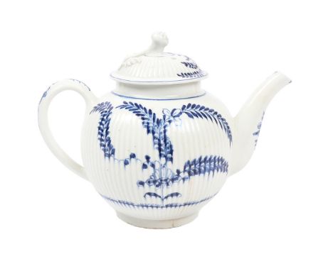 A LOWESTOFT PORCELAIN TEAPOT, CIRCA 1770. the tightly fluted lid with floral finial, the body decorated in the Immortelle pat
