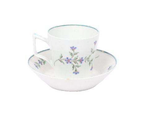 A LOWESTOFT PORCELAIN COFFEE CUP AND SAUCER. the tapering cup and saucer with polychrome cornflower decoration beneath a turq