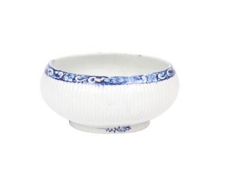 A LOWESTOFT PORCELAIN BUTTER TUREEN. of oval form, the ribbed body with foliate and scroll decorated rim, 13cm wide, 11cm dee