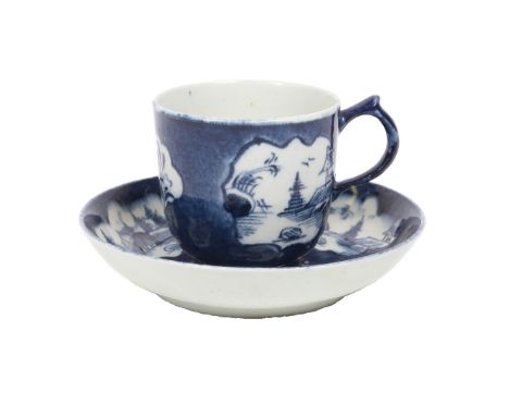 A LOWESTOFT PORCELAIN COFFEE CUP AND SAUCER. with vignettes depicting landscape scenes and floral sprays, on a powder blue gr
