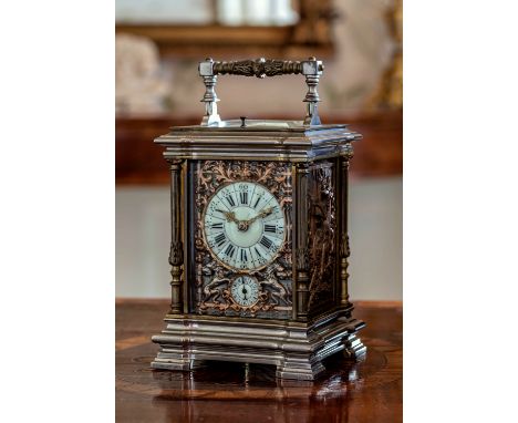 A good 19th century gilt and plated brass carriage clock with repeat and alarm, the segmented porcelain dial with Roman numer