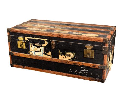 An antique steamer trunk by Ernest Hofmann of Austria, the wood and leather bound trunk with monogrammed canvas and gilt bras