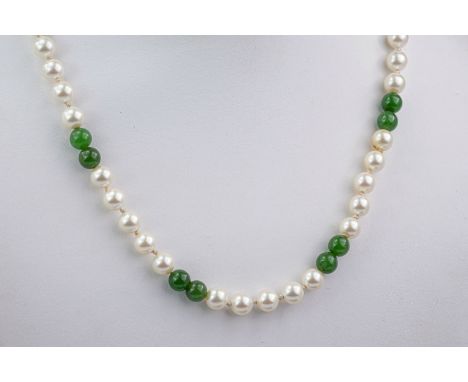 A 9ct gold, cultured pearl and jade necklace, each round pearl and jade bead measuring approximately 5mm and evenly distribut
