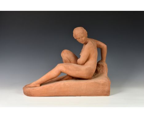 A terracotta model study of a female nude, first half 20th century, seated upon a rocky outcrop, signed to back 'Bouiculle' (