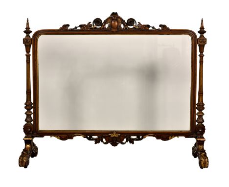 A fine, large carved walnut and parcel gilt glazed firescreen, early 19th century, in the Louis XIII style, the rectangular b