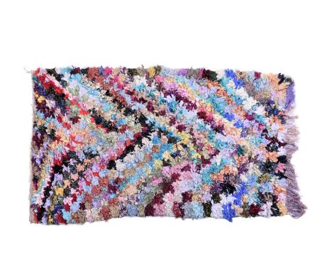 A vintage Moroccan rag rug, with multicoloured chevron design, 78 x 49½in. (198 x 125.75cm.).