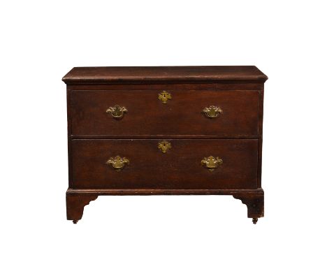An 18th century and later oak mule chest, alterations, of small proportions, the hinged two plank moulded top over a faux dra
