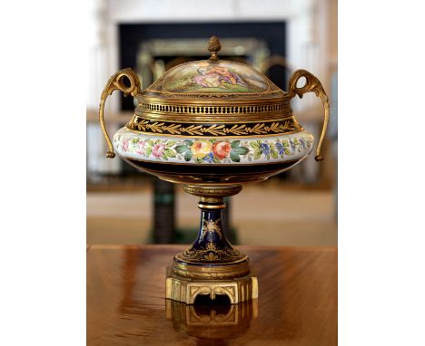 A large early 20th century Sevres ormolu mounted vase and cover, the domed cobalt blue domed cover surmounted by a berried fi