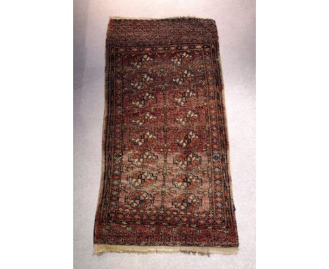 A small Tekke Bokhara rug, first half 20th century, 60 x 29in. (152.5 x 73.7cm.), worn. 