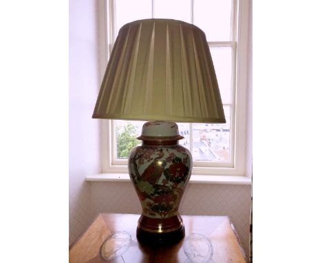 An Oriental style porcelain vase lamp, with pleated silk shade, 24½in. (62.2cm.) high. 