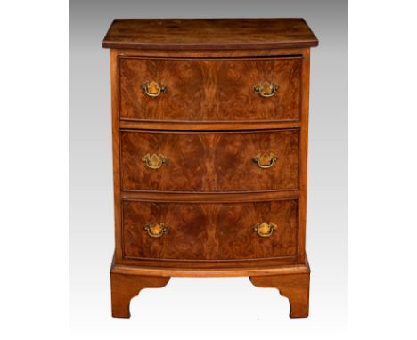 A 1930s the walnut three drawer chest, of small proportions, with reeded edge top, raised on shaped bracket feet, 20¾ x 16½in