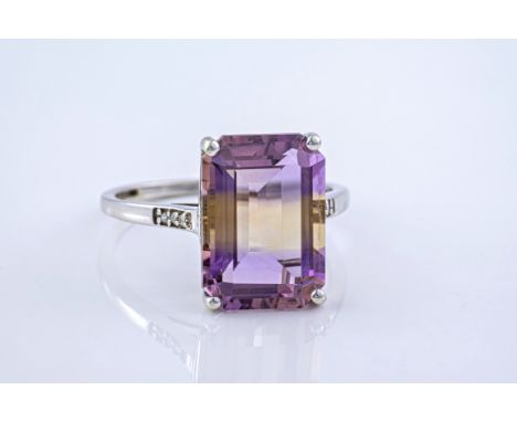 A 9ct and emerald cut ametrine cocktail ring, with diamond shoulders, the ametrine a light purple to the top and bottom of th