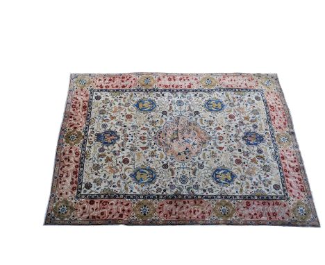 A large Persian Qum hunting design rug, probably mid-20th century, the central pale pink shaped medallion with a hunting scen