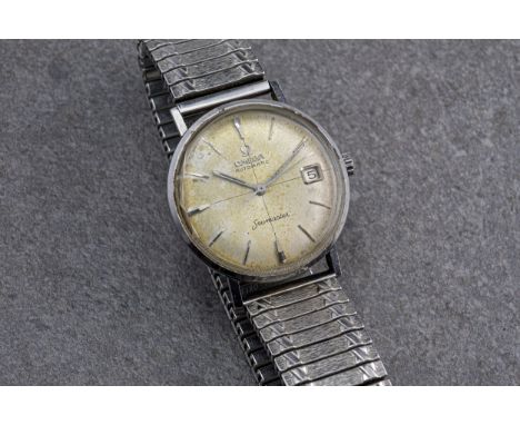 A vintage Omega Seamaster Automatic stainless steel gentleman's wristwatch, with 30mm. silvered crosshair dial with baton mar