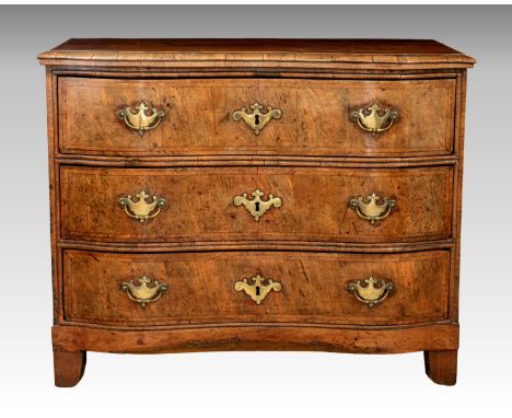 A Continental serpentine fronted three drawer commode, circa 1800, of small proportions, the moulded top over three long feat