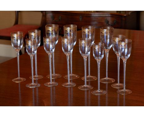An extensive set of gilded and enamelled Venetian glasses, first half 20th century, the bowls with gilt painted foliate decor