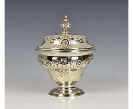 A late George II silver lidded sucrier, William Shaw and William Priest, London 1759, the urn shaped body with embossed flowe