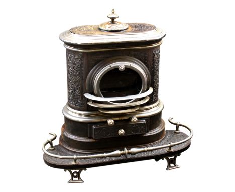 An antique Swiss multi-fuel cast iron wood burning stove, late-19th / early 20th century, blacked and plated finish, of round