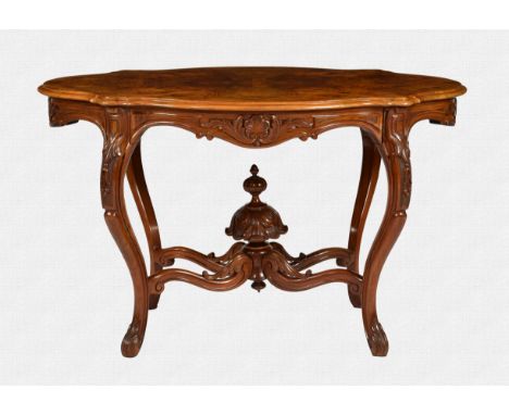 A good quality mid Victorian shaped oval centre table, reputedly Swedish, the burr walnut quarter veneered top over a shaped 