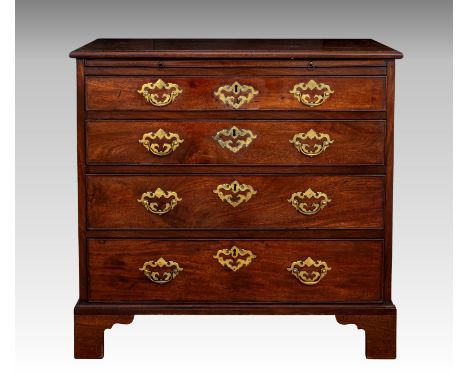A George III mahogany bachelor's chest, the thumb moulded top over a brushing slide and four long graduated drawers, with ori