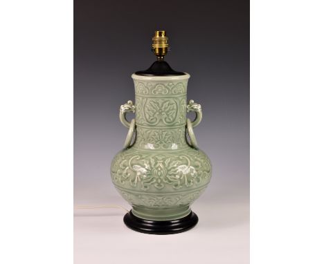 A Chinese style celadon glazed porcelain vase lamp, 20th century, of baluster form with long neck and twin fixed ring handles