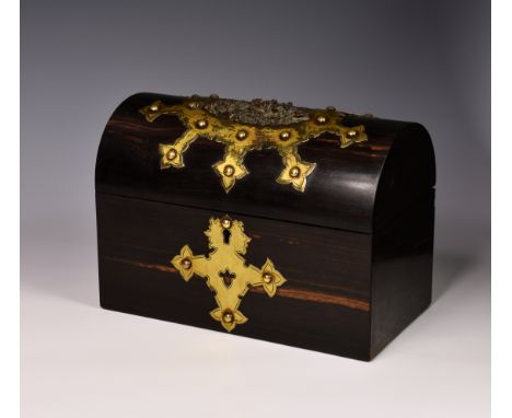 A Victorian gilt brass bound coromandel wood box, the domed top box with gilt brass strapwork mounts, the lid centred by a br