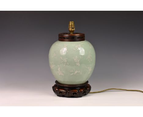 A Chinese celadon and white slip decorated porcelain ginger jar, converted to a lamp, probably 19th century, decorated with b