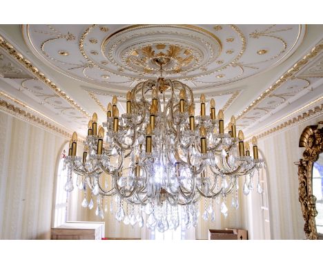 A magnificent 19th century style three tier fifty six light cut glass and gilt chandelier, second half 20th century, each mul