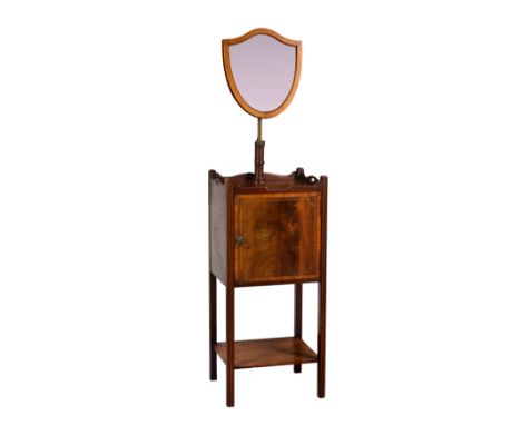 An Edwardian George III style cross banded mahogany gentleman's night table with shaving mirror, the shield shaped mirror wit