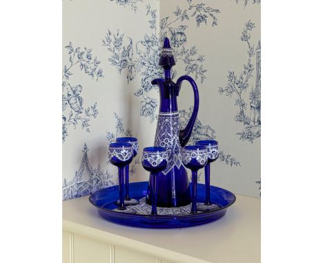 A Venetian blue glass and enamel decanter set, probably first half 20th century, comprising a decanter, five stemmed glasses 