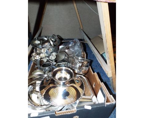 A selection of silver plate to include entrée dish, teapot, candle sticks, mugs, cream jug, comport etc.