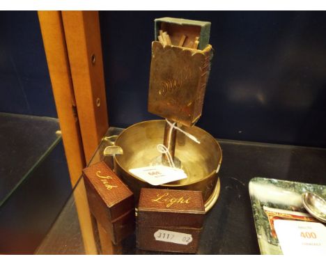 A 19thC leather bound travelling vesta case with matching inkwell and a brass trench art ashtray with attache match striker 