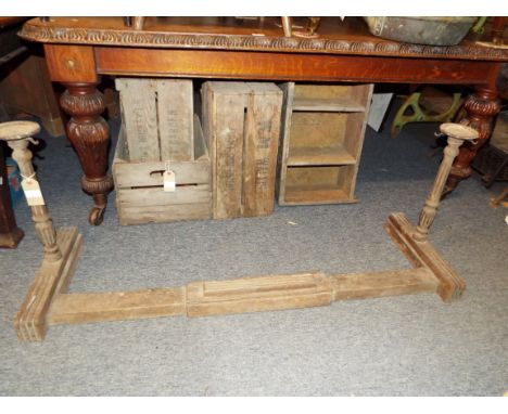 An Edwardian oak fluted fire fender with candle holders